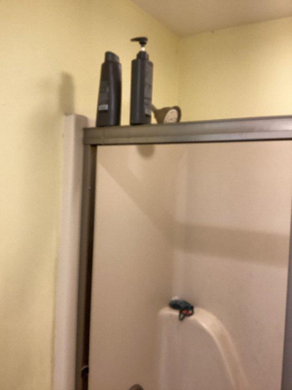 Provided estimate for conversion of existing tub/shower combination to stand-alone shower unit at residential property. Assessed current bronze-framed glass enclosure and white bathtub with failing fixtures experiencing continuous dripping issues. Presented cost-effective options for shower-only installation in same location, including fixture replacement recommendations and enclosure modifications to address deteriorating components while minimizing structural changes.
