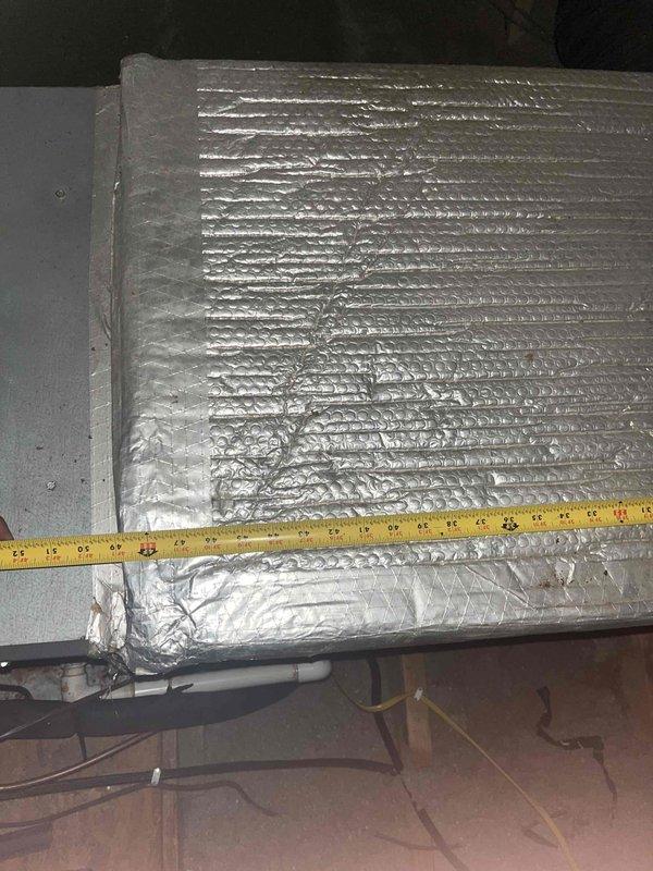 Completed comprehensive HVAC system replacement estimate for existing air handler and evaporator coil assembly located in attic space. Assessed current system configuration including foil-faced insulated air handler unit, copper refrigerant line set, PVC condensate drain line, and existing ductwork with reflective insulation. Documented equipment dimensions and spatial constraints for replacement unit sizing. Evaluated attic access, clearances, and installation requirements for new system components. Provided homeowner with detailed replacement options and specifications for complete system upgrade.