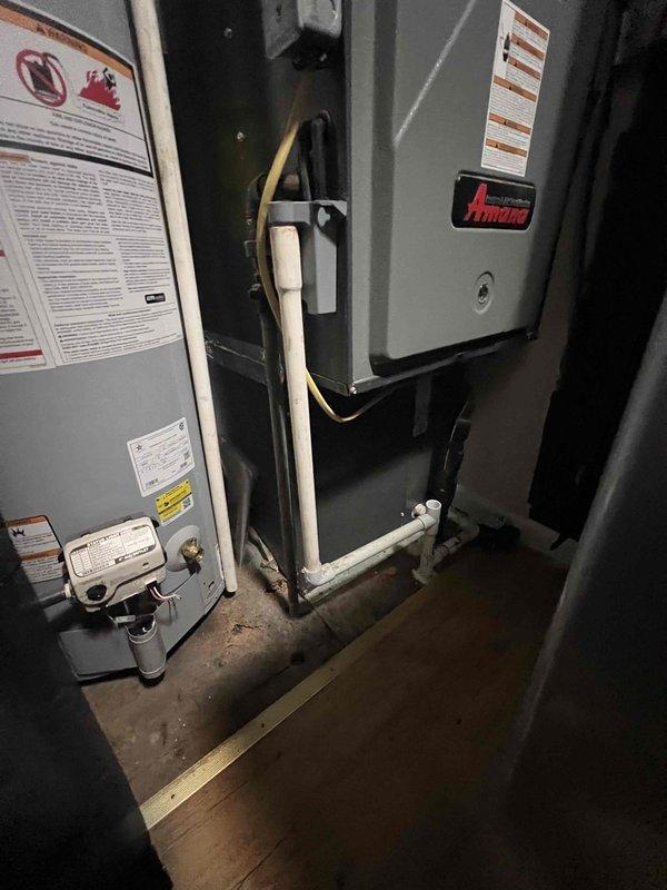 Conducted comprehensive HVAC system replacement estimate for existing customer with operational system seeking upgrade options. Evaluated current downflow furnace and Amana air handler configuration in basement utility space, documenting equipment specifications, clearances, and installation parameters. Assessed ductwork arrangement, base condition, and spatial requirements for high-efficiency AC/HP system compatibility, providing detailed replacement recommendations and configuration options for complete system upgrade.