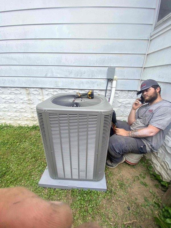 # HVAC Complete System Installation

Successfully completed full residential HVAC system installation including outdoor condensing unit and indoor air handler with associated ductwork and drainage systems. The outdoor unit was positioned on a concrete pad adjacent to the home's foundation with proper electrical conduit routing along the exterior wall. Interior installation in the basement mechanical room included mounting the air handler unit, connecting flexible metallic ductwork to existing rectangular trunk lines, and installing PVC condensate drain lines with appropriate shut-off valves. All equipment was properly secured, labeled per code requirements, and tested for operational functionality upon completion.