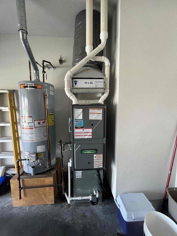 Completed monthly planned maintenance on residential HVAC system including furnace and outdoor condensing unit. Inspected 16x25x5 air filter on 8-year-old system, verified proper operation of heating and cooling equipment, checked refrigerant lines and electrical connections, and documented equipment condition through photographic records. All components found operating within normal parameters with no immediate service needs identified.