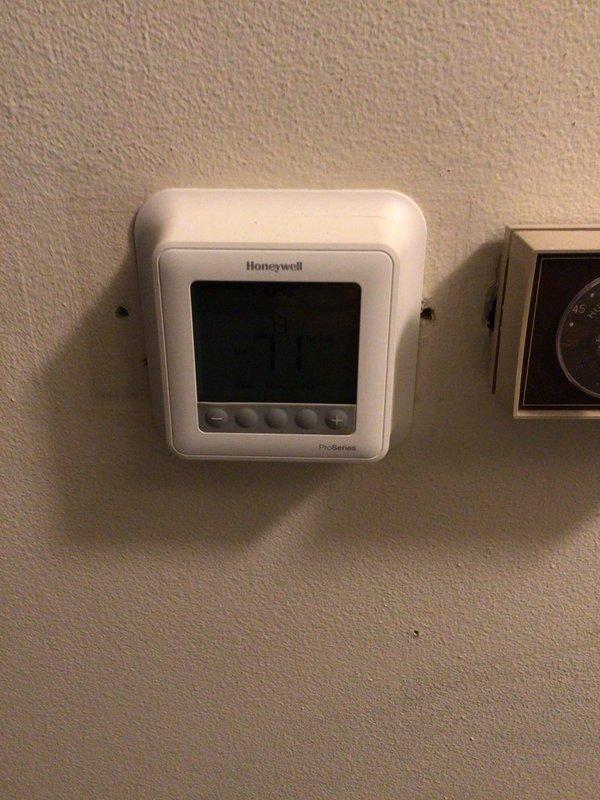 Completed annual planned maintenance on 14-year-old residential HVAC system as part of Gold Level service agreement. Performed comprehensive inspection of indoor and outdoor components, verified thermostat operation showing 21.0°F on Honeywell ProSeries unit, and inspected outdoor condenser unit with proper clearances and functional fan grille. System operating within normal parameters with 20x25x2 filter size noted for future service visits.