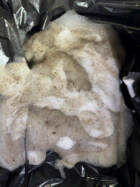 Conducted follow-up site visit to assess previously incomplete work and document current system conditions. Inspection revealed significant frost accumulation on refrigerant line with deteriorated insulation, indicating potential refrigerant flow issues or inadequate insulation coverage. Photographed insulation materials and affected copper piping with ice buildup for documentation and future reference.