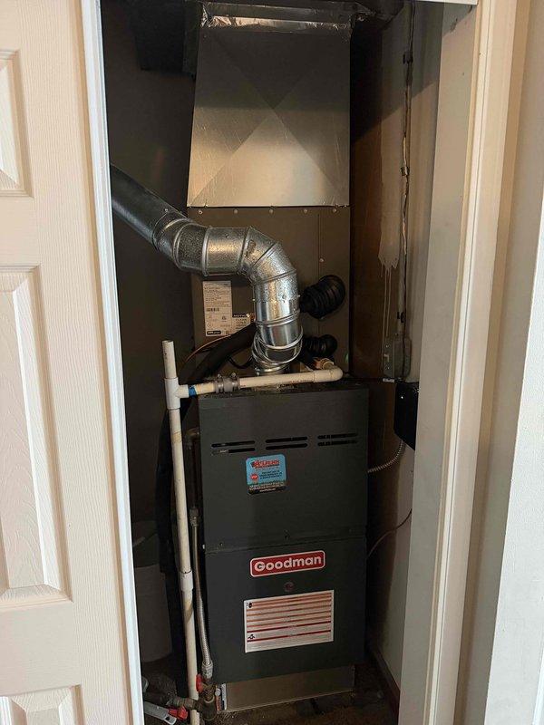Completed installation of 2-ton, 14.7 SEER air conditioning system with matching evaporator coil. The new Lennox evaporator coil was installed above the existing Goodman furnace in the indoor closet space, with proper refrigerant line connections and condensate drainage routed through PVC piping. All components were tested and verified operational upon completion.
