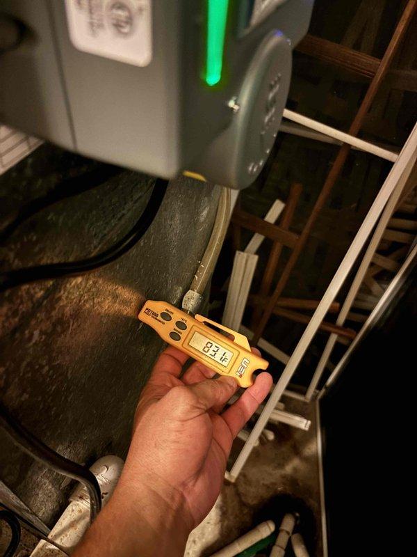 Responded to no cooling complaint with thermostat reading in the 80s and fan running but no cool air production. Upon inspection of the outdoor unit's electrical compartment, diagnosed failed dual run capacitor preventing compressor operation. Verified capacitor failure using digital multimeter with reading of 83.6 microfarads, which was significantly below manufacturer specifications. Replaced defective capacitor with OEM equivalent, reconnected all electrical connections, and restored power to system. Tested unit operation and confirmed compressor engagement, proper amperage draw, and adequate cooling airflow at registers. System returned to normal operation with satisfactory temperature differential.