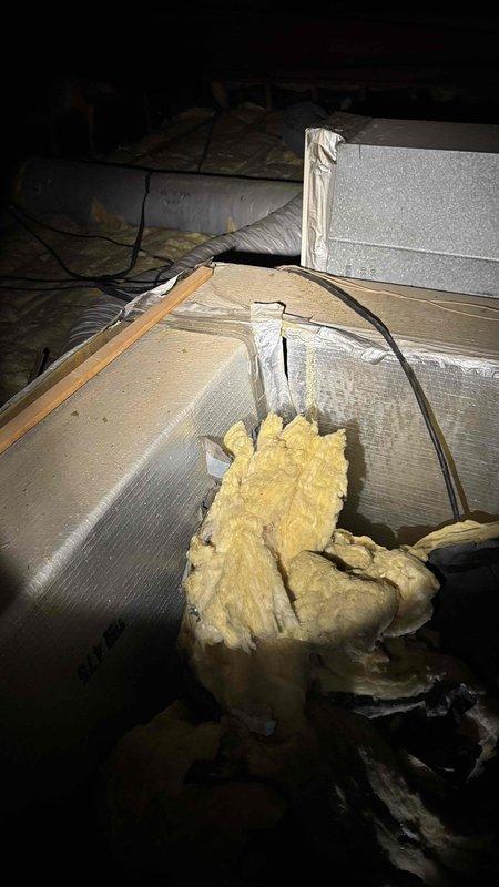 Performed comprehensive evaluation of 25-year-old air conditioning system and associated ductwork for potential replacement. Inspected attic space and documented deteriorating fiberglass insulation, aging flexible ductwork with visible repairs, and compromised insulation materials throughout the system. Assessed existing HVAC infrastructure including metallic and flexible ducts, noting signs of wear and reduced efficiency consistent with system age, and provided replacement recommendations for both cooling equipment and ductwork to address performance concerns.
