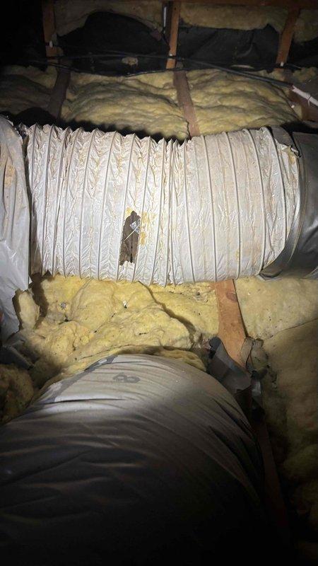 Performed comprehensive evaluation of 25-year-old air conditioning system and associated ductwork for potential replacement. Inspected attic space and documented deteriorating fiberglass insulation, aging flexible ductwork with visible repairs, and compromised insulation materials throughout the system. Assessed existing HVAC infrastructure including metallic and flexible ducts, noting signs of wear and reduced efficiency consistent with system age, and provided replacement recommendations for both cooling equipment and ductwork to address performance concerns.