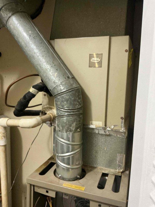 Responded to follow-up service call for water leak reported after 5-6 hours of system operation. Upon arrival, inspected HVAC furnace unit and surrounding components including ductwork, condensate drainage system, and associated piping. Conducted thorough visual examination of the unit's internal components, blower assembly, control board, and all visible connections. Photographed the installation to document the current condition of the system, including the furnace cabinet with access panel removed, copper and PVC piping, and ductwork connections with foam insulation. Identified potential leak sources in the condensate drainage system and inspected all pipe connections, joints, and drain lines for proper installation and secure fittings. Verified the integrity of the condensate pump operation and drainage pathway to ensure proper water evacuation from the system during cooling operation.