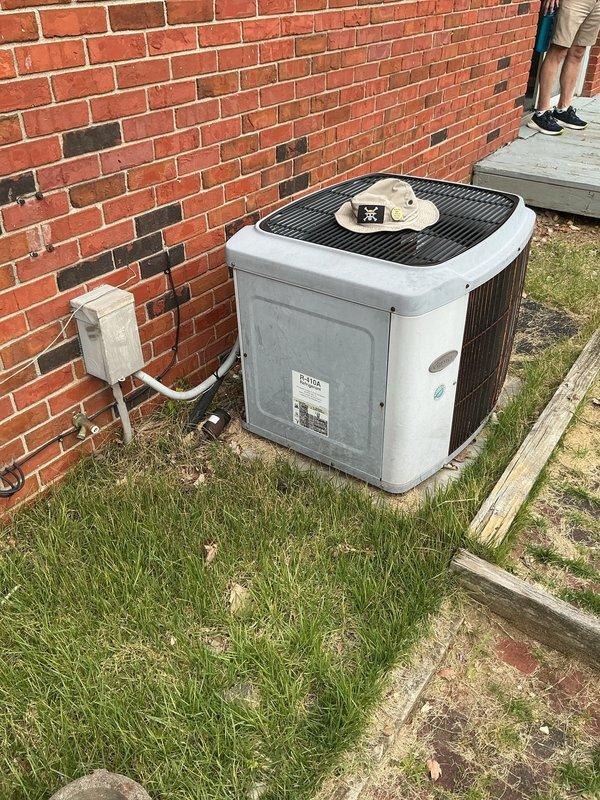 Conducted on-site evaluation at newly purchased residential property for complete HVAC system replacement estimate. Assessed existing air handler unit and outdoor condensing unit, both requiring full replacement. Documented current equipment configuration in utility room alongside water heater and water treatment system, as well as exterior condenser placement adjacent to brick wall foundation. Provided comprehensive replacement options and recommendations for new heating and cooling system installation.