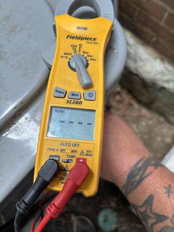 Returned to address ongoing no-cooling condition on R-410A system following previous day's service visit. Upon arrival, verified system still not operating properly and performed comprehensive diagnostics using digital manifold gauge and electrical testing equipment. Measured operating pressures at 229.1 psig high side and 224.6 psig low side, with superheat reading of 100°F and subcooling at -0.3°F, indicating critical refrigerant charge issue. Conducted electrical testing of system components to rule out compressor or control failures. Documented system conditions with detailed photographs of diagnostic readings and equipment setup. No additional charges applied for callback service per company policy.