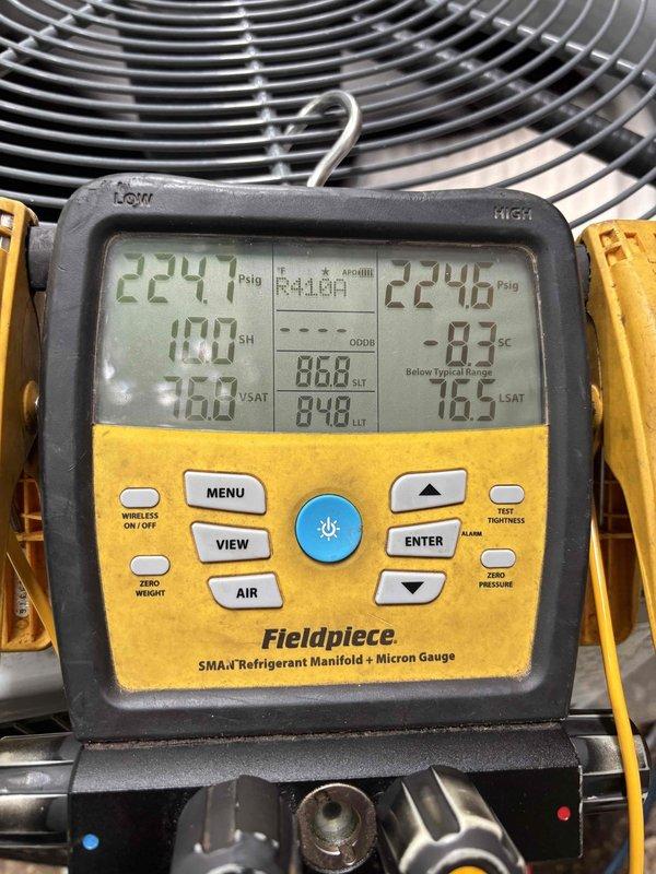 Returned to address ongoing no-cooling condition on R-410A system following previous day's service visit. Upon arrival, verified system still not operating properly and performed comprehensive diagnostics using digital manifold gauge and electrical testing equipment. Measured operating pressures at 229.1 psig high side and 224.6 psig low side, with superheat reading of 100°F and subcooling at -0.3°F, indicating critical refrigerant charge issue. Conducted electrical testing of system components to rule out compressor or control failures. Documented system conditions with detailed photographs of diagnostic readings and equipment setup. No additional charges applied for callback service per company policy.