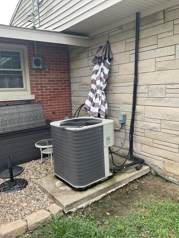 Conducted comprehensive replacement estimate for residential central air conditioning system with failed compressor. Evaluated existing outdoor condenser unit positioned on concrete pad with electrical connections and assessed interior air return system including ceiling-mounted filter grille. Documented equipment condition, measured installation areas, reviewed ductwork accessibility, and provided complete replacement options for aging HVAC system that ceased operation due to locked compressor.