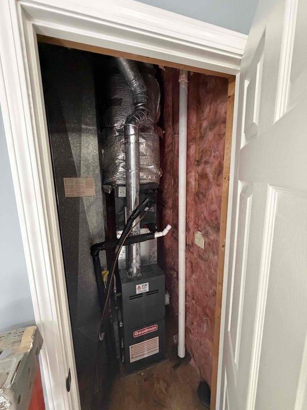 Completed full HVAC system installation featuring a 2-ton Goodman air handler with 15.5 SEER rating and 96% efficiency gas furnace in interior utility closet. Installed UVC and UVV germicidal lighting systems for enhanced air quality and coil protection. Configured flexible insulated supply ductwork routing from air handler through attic space, securing all runs to structural framing with proper support and insulation coverage. Established condensate drain line using white PVC piping with proper pitch and termination. Completed all electrical connections and low-voltage wiring for system controls and safety devices. Verified proper clearances around equipment for maintenance access and code compliance. System tested and operational with all components functioning within manufacturer specifications.