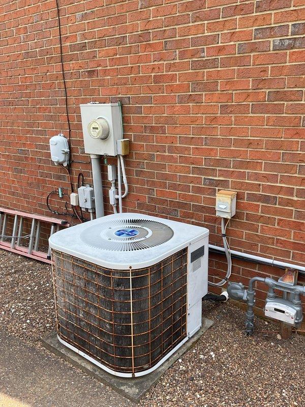 Completed comprehensive replacement estimate for 20+ year old HVAC system including both air conditioning condenser unit and furnace. Evaluated existing operational equipment, documented current interior furnace components including electrical connections, blower assembly, and air filtration system, as well as exterior condensing unit mounted on concrete pad with electrical disconnect and refrigerant line connections. Provided homeowner with complete system replacement options and efficiency upgrade recommendations for both heating and cooling equipment.