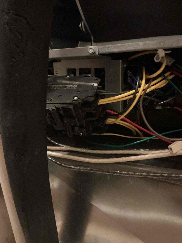Responded to follow-up service call for HVAC system reported as not maintaining desired temperature during extreme heat conditions. Performed comprehensive inspection of unit's electrical control panel and wiring systems in attic installation. Verified all wire connections at terminal blocks, inspected control board components including capacitors and relays for proper operation, and documented system configuration with photos of control panel and wiring harness. All electrical connections found secure with no signs of loose terminals or damaged conductors. System scheduled for additional evaluation during next available service window to monitor performance under continued high ambient temperature conditions.