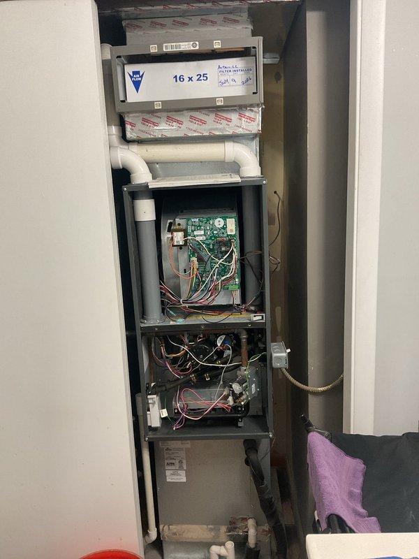 Completed planned maintenance on 4-year-old vertical HVAC system with Aspen refrigerant evaporator and R-410A refrigerant. Inspected air handler unit including filter compartment with 16x25x5 filter, control boards, electrical connections, and wiring throughout system. Verified proper operation of all components including circuit boards, relay systems, and TXV installation. Documented system condition through photographs showing internal mechanical and electrical components with access panels open. Customer requested polarized filter and duct cleaning be scheduled for next maintenance visit per previous technician notes.