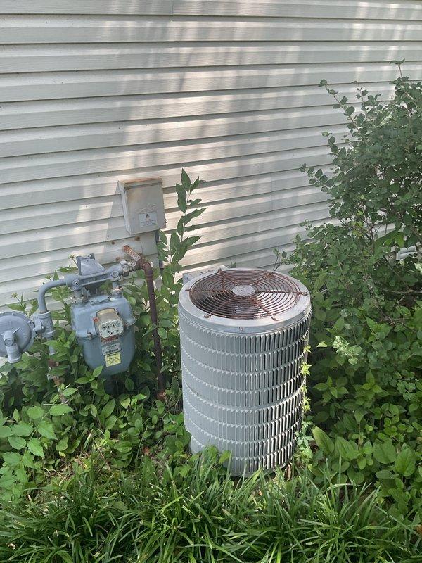 Conducted on-site assessment of existing 40-year-old air conditioning system original to 1986 construction. Documented current outdoor condenser unit model CF26C1X31A, serial number W26A0559655, and provided estimate for complete AC system replacement due to age and obsolescence of equipment.