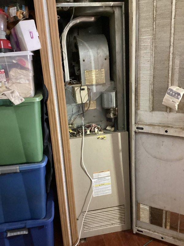 Responded to new customer inquiry for HVAC system replacement estimate. Evaluated aging outdoor condenser unit showing significant weathering, discoloration, and deteriorated top surface with visible patina, along with indoor furnace system located in utility closet. Documented existing equipment conditions through comprehensive photography, capturing outdoor unit positioned on concrete pad with worn components and indoor vertical furnace installation with associated ductwork and cylindrical heating components. Provided Green - A+ tier replacement estimate for complete HVAC system upgrade to address equipment age and performance concerns.