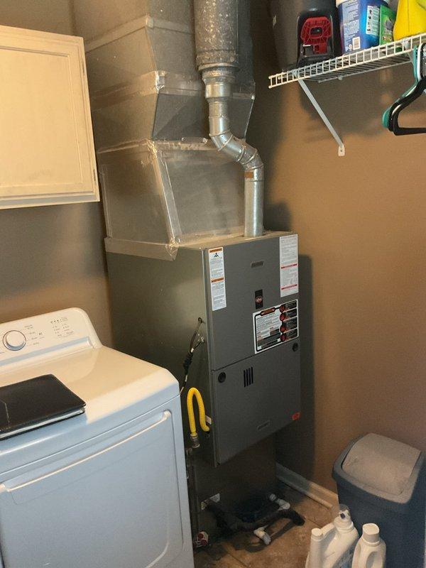 Conducted comprehensive assessment of existing HVAC system for medium-sized residential property (1600-2200 sq ft) requiring complete heating and cooling replacement. Evaluated current natural gas furnace located in interior utility room and outdoor air conditioning condensing unit positioned on concrete pad against brick exterior. Documented existing equipment specifications, ductwork configuration, electrical connections, and refrigerant line routing. Prepared detailed replacement estimate for new traditional gas furnace and air conditioning system sized appropriately for property square footage and existing infrastructure. Assessed installation requirements including utility room clearances, outdoor unit placement, and compatibility with current duct system.