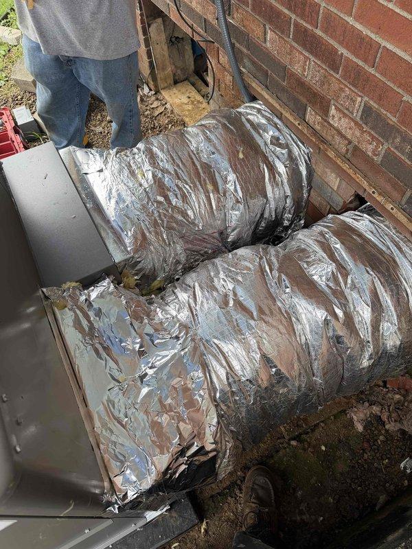 Completed installation of 3-ton, 14 SEER, 80% efficiency gas package unit. Installed new Honeywell TH2110U4004 thermostat, configured flexible ductwork with reflective insulation wrap, and established all necessary electrical and gas connections to the outdoor unit mounted against brick exterior wall.