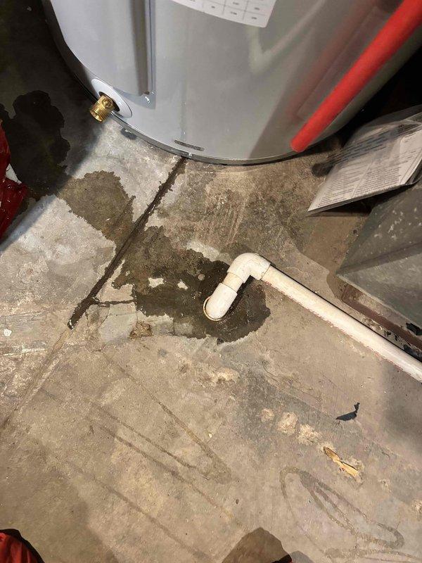 Responded to no-cool call on 2-year-old system with no airflow through vents and thermostat displaying "service urgent" error. Upon arrival, found indoor temperature rising from setpoint of 73°F to 76°F with complete loss of air circulation. Performed diagnostic evaluation of HVAC system including electrical components, air handler operation, and refrigerant circuit. Documented supply air temperature reading of 52.7°F and inspected mechanical room conditions, noting water damage on concrete floor near water heater that may require future attention but was unrelated to current HVAC issue. Identified system failure causing loss of cooling and airflow, completed necessary repairs to restore full system operation and verified proper function before departure.