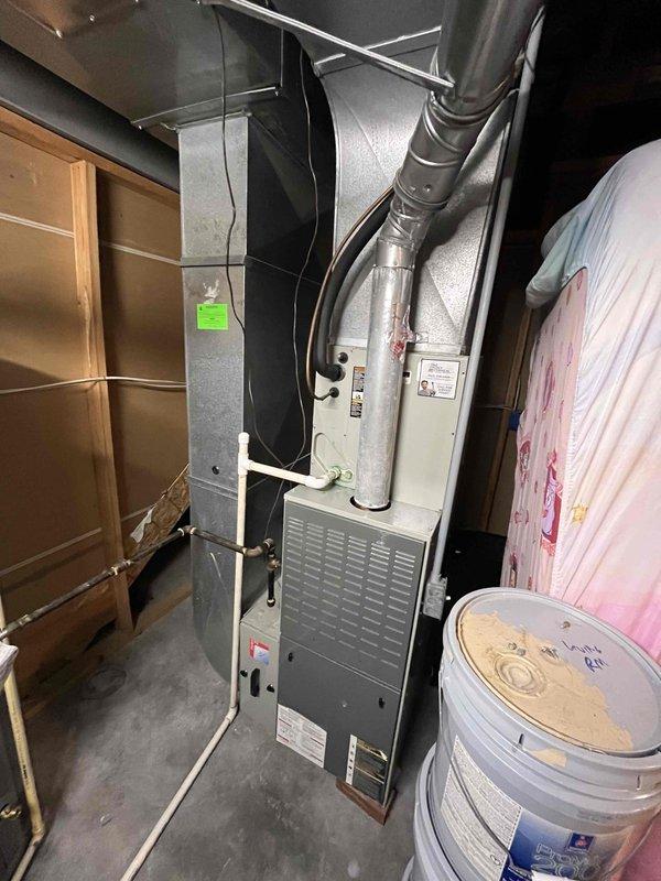Conducted comprehensive evaluation of existing HVAC system that was failing to adequately condition the living space. Assessed furnace, air handler, and associated ductwork in utility area to determine equipment condition and replacement requirements. Documented current electrical panel configuration and circuit capacity to ensure proper integration of new HVAC equipment. Prepared detailed estimate for complete system replacement including removal of outdated equipment, installation of properly sized heating and cooling units, and verification of adequate electrical service for upgraded system.