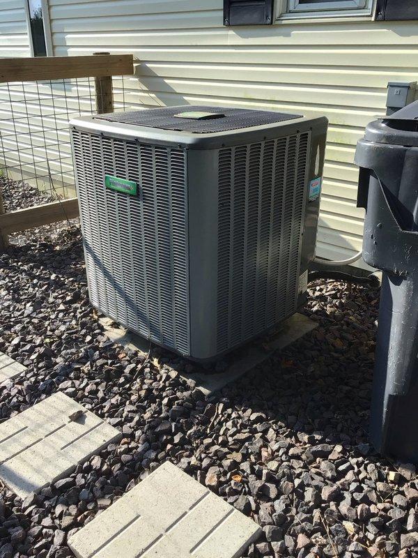 Completed scheduled AC tune-up on residential split system air conditioning unit. Performed comprehensive maintenance inspection of outdoor condenser unit, verified proper operation of all mechanical components, and documented system condition with photos showing interior blower assembly and external condenser placement. Unit found operational with adequate clearance from structure and proper gravel base installation.