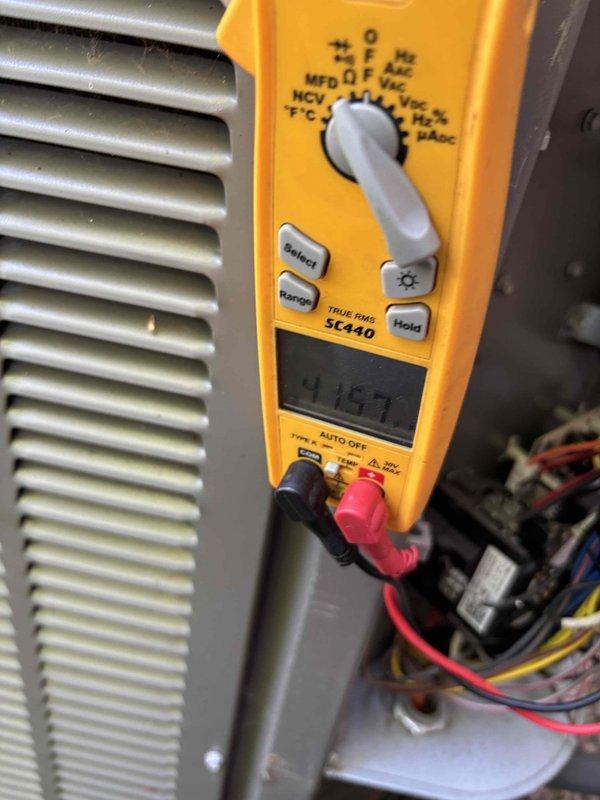 Completed annual Platinum Level maintenance on single HVAC system during second scheduled visit. Performed comprehensive system diagnostics including electrical measurements with digital multimeter, recording voltage reading of 114.7V at compressor contactor. Inspected evaporator coil, refrigerant lines, and internal components, noting accumulated dust and grime on coil fins requiring attention. Replaced two 20x20x2 filters and one 20x20 polarized filter per maintenance agreement specifications. Verified proper operation of compressor, electrical connections, and control systems. System is approaching three-year service agreement renewal period.