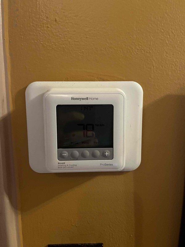 Responded to service call for non-operational air conditioning system where outdoor unit was producing noise but condenser fan failed to spin. Upon inspection, diagnosed failed condenser fan motor on aging outdoor unit and evaluated overall system condition including RGF HALO LED air purification system and Honeywell Home ProSeries thermostat. Provided comprehensive estimate for complete system replacement due to age and condition of existing equipment, though discussed repair options with property owner as alternative solution.