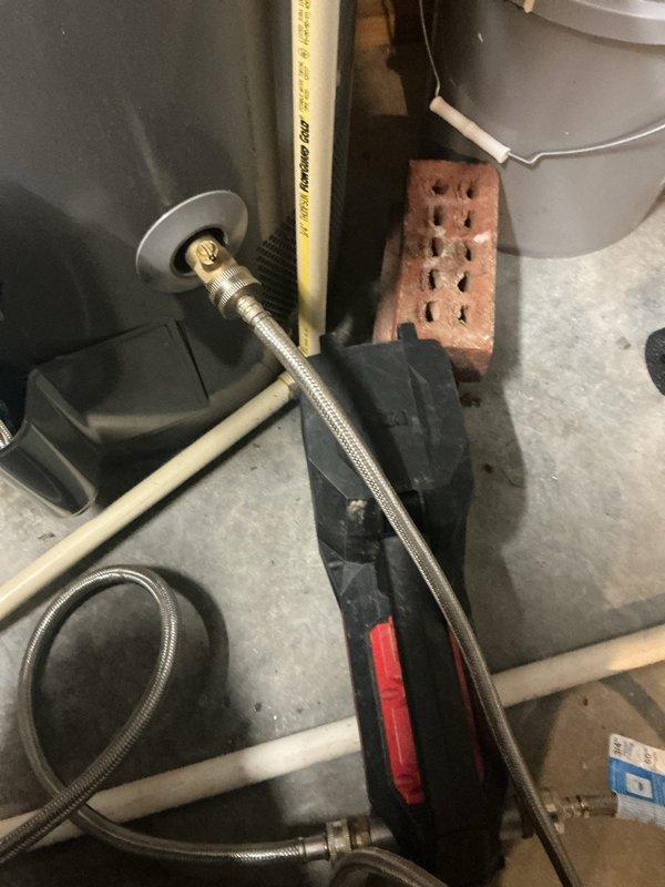 Performed comprehensive tanked water heater flush and maintenance service. Drained sediment buildup from tank bottom, flushed system with fresh water until discharge ran clear, and inspected all plumbing connections including braided supply lines and brass fittings for proper operation. Verified temperature and pressure relief valve functionality, checked anode rod condition, and ensured all components were secure and leak-free upon completion.