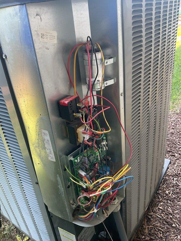 Responded to no-cooling complaint on 4-year-old residential HVAC system where outdoor unit was running continuously without cycling off. Upon arrival, performed diagnostic evaluation of condensing unit and control board operations. Connected manifold gauges to measure refrigerant pressures and inspected electrical components including circuit boards, capacitors, and contactor assembly. Identified issue with outdoor unit failing to respond to thermostat call properly, causing continuous operation regardless of indoor temperature demand. Inspected Emerson control board for proper relay function and verified all wire connections at terminal blocks. Checked capacitor values and contactor operation to rule out mechanical failure. System was cycling properly at time of inspection after being turned off overnight by homeowner. Advised on proper thermostat operation and system monitoring going forward.