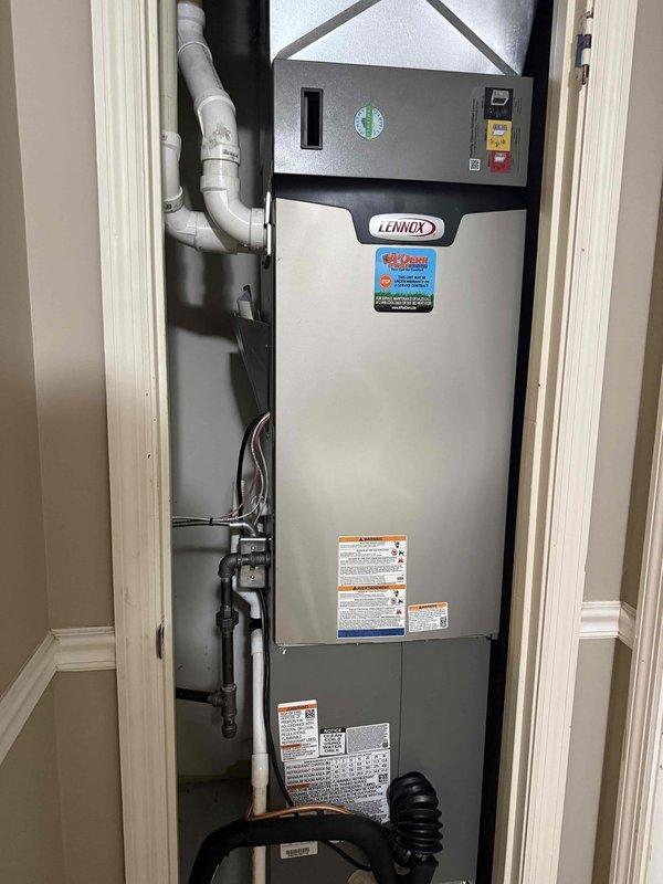 Completed full HVAC system installation featuring a 3-ton, 18 SEER Lennox unit with 99% AFUE furnace in interior closet space. Installation included proper venting with PVC condensate drainage, gas line connections, electrical wiring, and flexible ductwork integration, with system tested and operational upon completion.