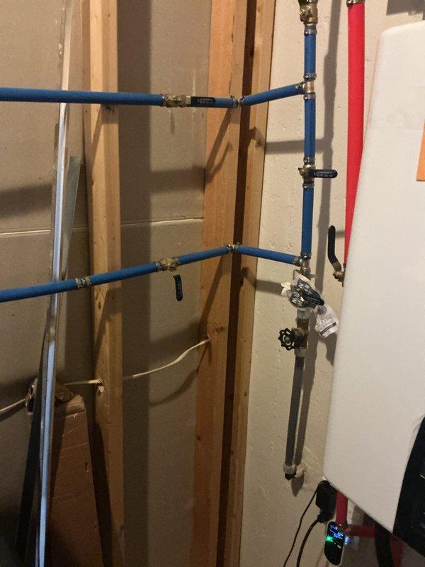 Responded to service call for spigot installation and plumbing system evaluation. Inspected and verified proper installation of PEX water supply lines with brass fittings, including blue hot and cold water lines with appropriate shutoff valves and connections. Confirmed floor drain functionality and drainage system integrity in utility area, ensuring all plumbing components met code requirements and operated correctly.