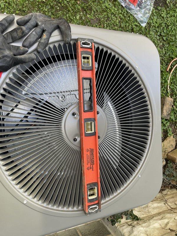 Completed full HVAC system installation including outdoor condenser unit placement on concrete pad. Unit was properly leveled and positioned per manufacturer specifications, with all components verified for correct installation and operational readiness.