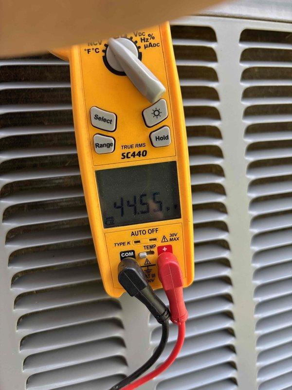 Completed routine planned maintenance on residential air conditioning system. Performed comprehensive system inspection and diagnostic testing using digital multimeter to verify electrical readings and proper voltage levels throughout the unit. All measurements were within manufacturer specifications at 44.55 volts as documented. Conducted standard AC tune-up procedures including visual inspection of all accessible components, ductwork examination, and equipment performance verification to ensure optimal system operation for the cooling season.