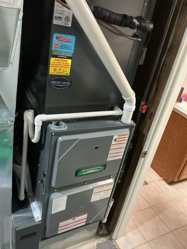 Completed second annual Platinum Level maintenance on a 7-year-old residential HVAC system. Performed comprehensive inspection and servicing of both indoor furnace unit and outdoor condensing unit. Changed 20x25x5 air filter and conducted full system diagnostics. Inspected furnace installation in mechanical room, verifying proper operation of all components, checking PVC condensate drainage, and examining ductwork connections. Evaluated outdoor condenser unit positioned on gravel pad, confirming adequate airflow through ventilation slats and proper electrical connections. All equipment operating within manufacturer specifications with no deficiencies noted. System ready for continued service. Customer due for renewal.