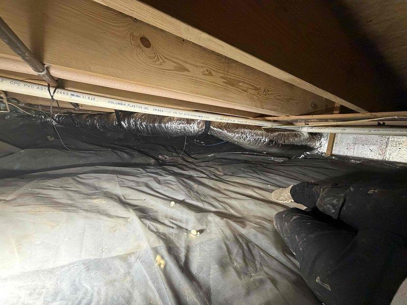 Installed additional 7-inch flexible supply duct runs in crawl space to serve kitchen window bench area. Ductwork was properly secured to floor joists using metal strapping, routed across existing vapor barrier, and insulated with reflective silver wrap to prevent heat loss and condensation. Installation completed in accordance with standard residential HVAC practices for conditioned air distribution.