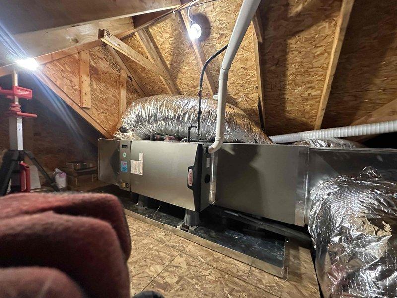 Completed installation of a 4-ton, 17 SEER air conditioning system with 97% AFUE furnace as an upsell upgrade. Installed new air handler unit in attic space with proper condensate drain lines and connected flexible ductwork to both supply and return plenums. Mounted outdoor condenser unit on concrete pad with appropriate clearances, installed electrical disconnect box, and ran refrigerant line set and electrical connections between indoor and outdoor units. System was properly charged, tested for proper operation, and left in fully functional condition.