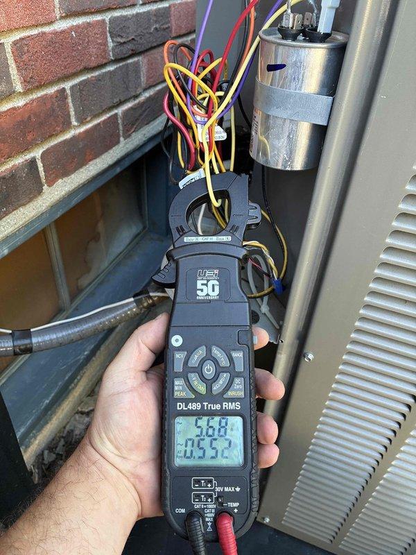 Completed scheduled HVAC maintenance tune-up on residential system. Performed comprehensive electrical diagnostics using digital multimeter, measuring voltage at 374.4V and verifying amperage draws at outdoor condensing unit. Tested capacitor functionality and inspected all electrical connections, confirming proper operation of all components.