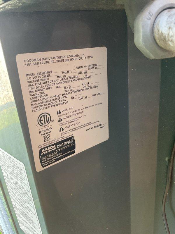 Completed Platinum Level maintenance on a single Goodman HVAC system (Model: ASPT603NHLB) serving the residence. Performed comprehensive inspection of the outdoor condensing unit positioned on concrete pad against exterior brick wall, verifying proper clearances and operational parameters. Replaced 20x20x1 air filter as part of routine maintenance protocol. Inspected condensate drain line routing along building exterior, confirming proper drainage function. Evaluated electrical connections, voltage specifications (208-230V), and circuit breaker compatibility per manufacturer specifications. Documented equipment condition through photographic records showing unit exterior, manufacturer data plate, and installation location. System operational and running within normal parameters upon completion of maintenance service.