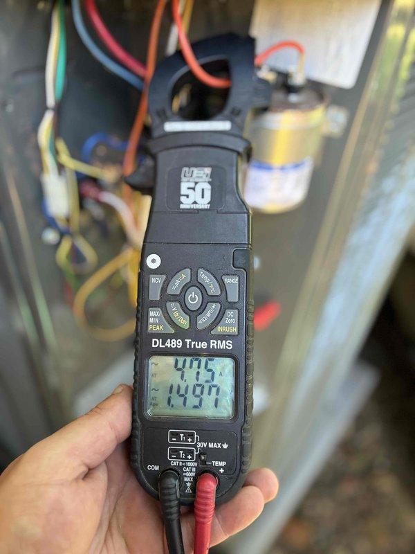 Completed first planned duo maintenance visit for Gold Level member with two systems aged 1.5 and 20 years. Performed comprehensive inspection and testing on both units, including electrical diagnostics with multimeter readings showing voltage at 405V and current draw at 14.037A on primary system, and 2.33V with 0.1156A measurements on secondary system components. Verified capacitor operation, tested control board functionality, and inspected all electrical connections and wiring. Changed customer-furnished filters and documented system performance with photographic evidence for service records.