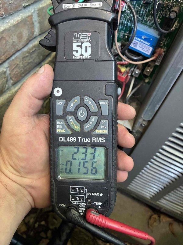 Completed first planned duo maintenance visit for Gold Level member with two systems aged 1.5 and 20 years. Performed comprehensive inspection and testing on both units, including electrical diagnostics with multimeter readings showing voltage at 405V and current draw at 14.037A on primary system, and 2.33V with 0.1156A measurements on secondary system components. Verified capacitor operation, tested control board functionality, and inspected all electrical connections and wiring. Changed customer-furnished filters and documented system performance with photographic evidence for service records.