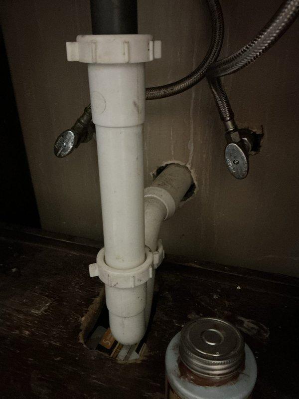 Successfully replaced bathroom faucet assembly with new brushed nickel three-hole widespread fixture featuring high-arc spout and dual lever handles. Removed existing faucet, cleaned mounting surface, and installed new unit with proper sealing to white ceramic sink basin. Connected hot and cold water supply lines using braided stainless steel flexible hoses with secure compression fittings. Verified all connections under sink were leak-free and properly tightened. Tested water flow and temperature control on both handles, confirming proper operation and drainage through existing PVC trap assembly. All components functioning correctly upon completion.