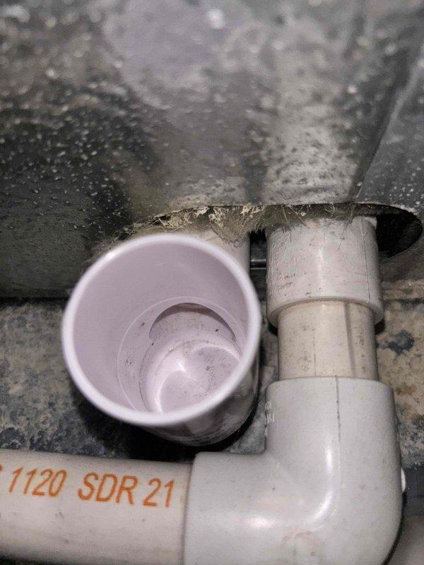 Responded to no-cooling call on 8-year-old residential HVAC system with warm air blowing from vents and non-operational outdoor unit condenser fan. Upon arrival, confirmed indoor airflow present but outdoor fan motor completely inoperative. Performed diagnostic evaluation of outdoor unit electrical components and identified failed dual-run capacitor with visible heat damage and burn marks on mounting panel. Capacitor tested at zero microfarads, well below manufacturer specifications, preventing both compressor and condenser fan motor from starting properly. Removed defective PROCER capacitor and replaced with new OEM-equivalent dual-run capacitor rated to system specifications. Cleaned electrical connections and mounting surface, removing carbon deposits from previous component failure. Verified all wire terminations secure at capacitor terminals and control board. Restored power to unit and confirmed compressor and condenser fan motor both operating within normal parameters. Checked a