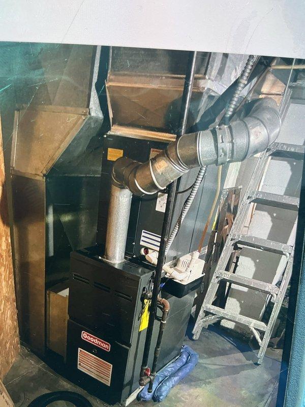 Conducted comprehensive HVAC replacement estimate for existing Goodman system struggling to maintain adequate heating and cooling capacity. Evaluated current 2-ton Goodman furnace installation with A-coil configuration located in utility space, documenting existing ductwork layout, flexible metallic duct connections, and system accessibility. Assessed installation area conditions including wooden framing, available workspace clearances, and existing mechanical infrastructure to determine optimal replacement specifications. Photographed current equipment positioning, duct routing, and mechanical room configuration to develop accurate replacement proposal for new 2-ton Goodman system with A-coil assembly.