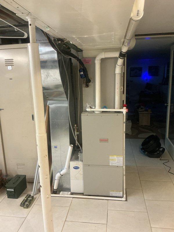 Conducted comprehensive HVAC system replacement estimate at residential property. Evaluated existing furnace/air handler unit and water heater installation in basement utility room, documenting current equipment configuration including ductwork layout, PVC condensate drainage, and electrical connections. Assessed mechanical room infrastructure and discussed replacement system options with homeowner during scheduled consultation appointment.
