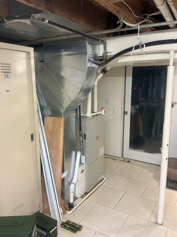 Conducted comprehensive HVAC system replacement estimate at residential property. Evaluated existing furnace/air handler unit and water heater installation in basement utility room, documenting current equipment configuration including ductwork layout, PVC condensate drainage, and electrical connections. Assessed mechanical room infrastructure and discussed replacement system options with homeowner during scheduled consultation appointment.