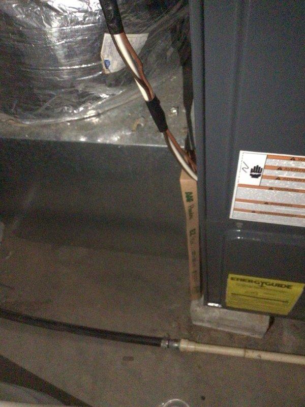 Conducted comprehensive assessment of existing HVAC system including Robertshaw digital thermostat and attic-mounted air handler unit with refrigerant lines and ductwork. Documented current system condition through detailed photography and discussed replacement options with homeowner, scheduling follow-up appointment for new system estimate with financing information.