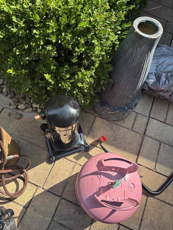Conducted HVAC system diagnostics and repair preparation at residential property. Part staged and ready for installation with vacuum pump and recovery equipment positioned on-site per service protocol. Unit accessible and prepared for scheduled repair completion.