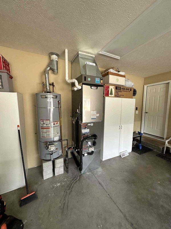 Completed full HVAC system installation including a 4-ton, 18 SEER outdoor condensing unit and matching indoor air handler with all necessary refrigerant lines, electrical connections, and condensate drainage. Installed Lennox outdoor unit on concrete pad with proper clearances, mounted electrical disconnect box, and ran line set through exterior wall penetration. Interior installation included air handler placement in garage utility area with PVC condensate drain routing, gas line connections, and supply/return ductwork integration. All refrigerant lines were properly insulated, system was evacuated and charged to manufacturer specifications, and electrical connections were completed per code requirements. Verified proper airflow, tested all safety controls, and confirmed system operation across all modes. Installation meets all local building codes and manufacturer warranty requirements.